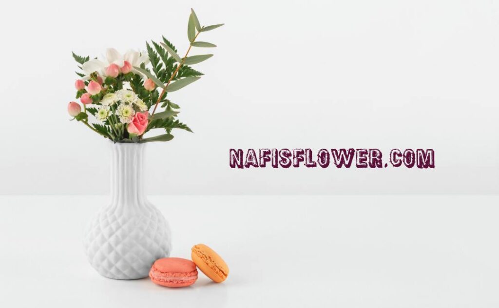 vase with flowers macarons beside 1 1